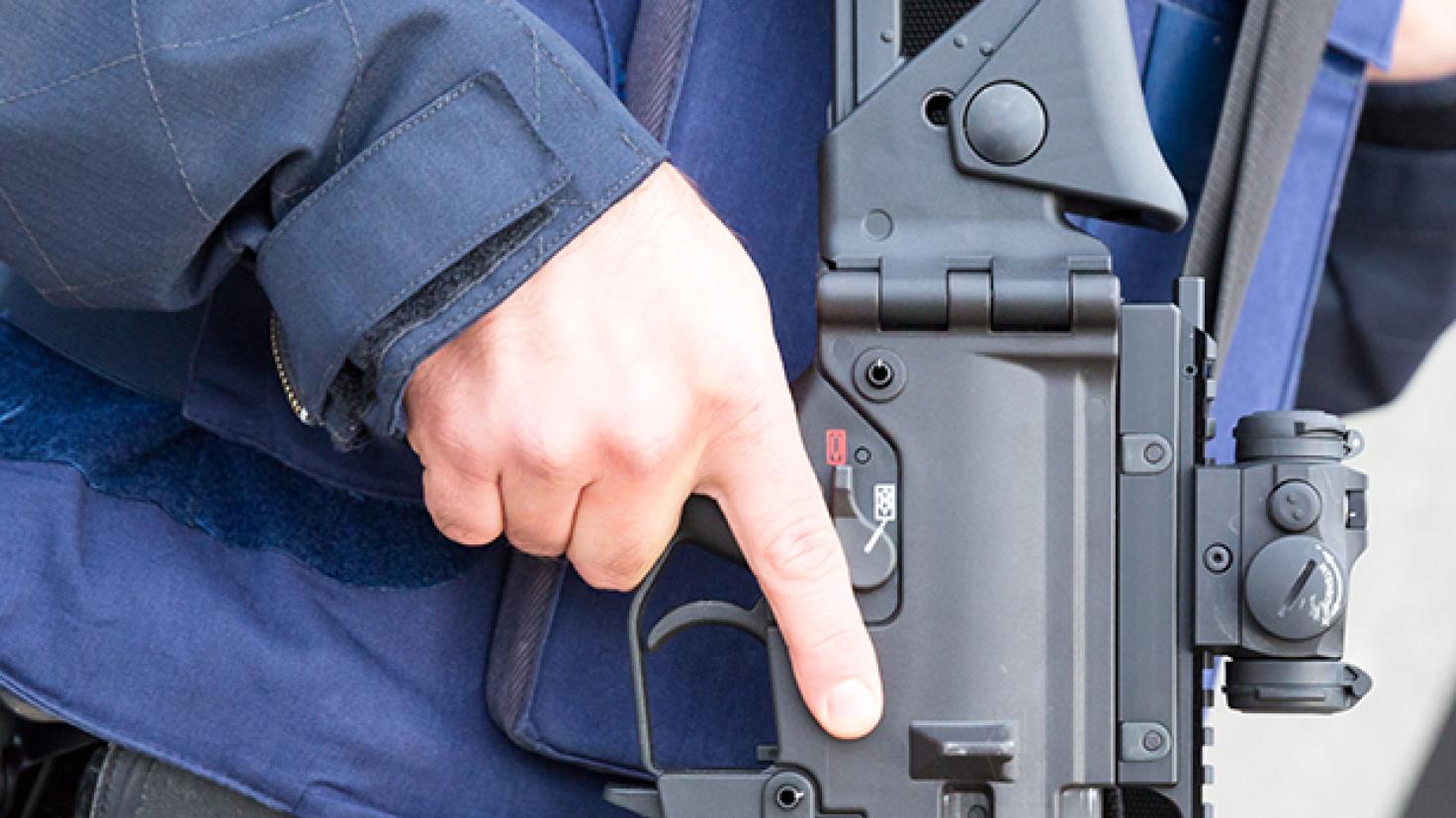 Close up of a hand holding a weapon